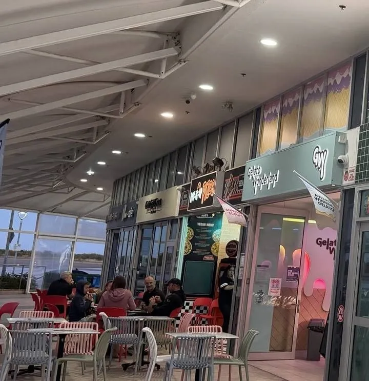 Gelato Wonderland's shopfront with outdoor tables under the Aqua awning